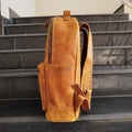 Side profile of the Bondi Beach Leather Backpack highlighting its slim silhouette and smooth stitching