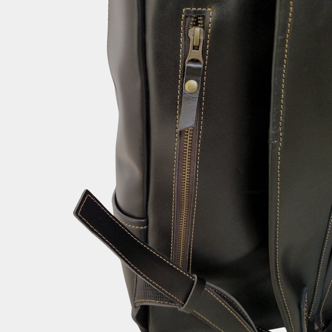 Close up view of back hidden zipper pocket of black Grampian leather backpack