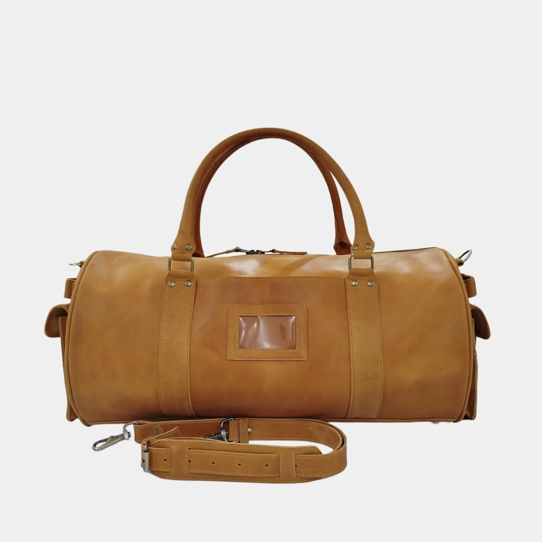 Front view of Brown costal travel duffle with removable shoulder strap in front