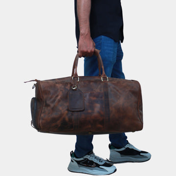 Handmade leather duffle bag with full-grain leather, showcasing durable stitching and a spacious interior for travel or gym use.