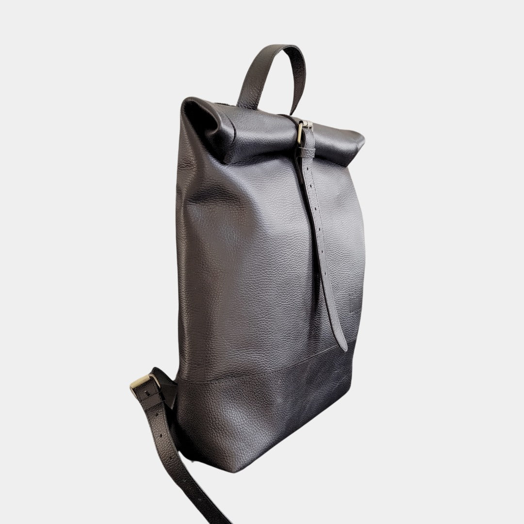 Compact leather backpack for everyday essentials, offering a sleek and minimalist look