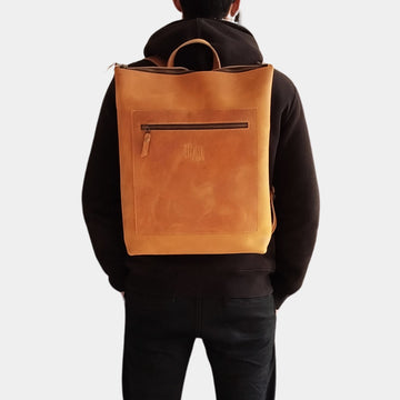 Guy in black hoodie posing stylish Brown Kakadu Leather Backpack 