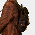 Side view of Premium Leather cityscape Trekker Backpack sowing side snap button pocket