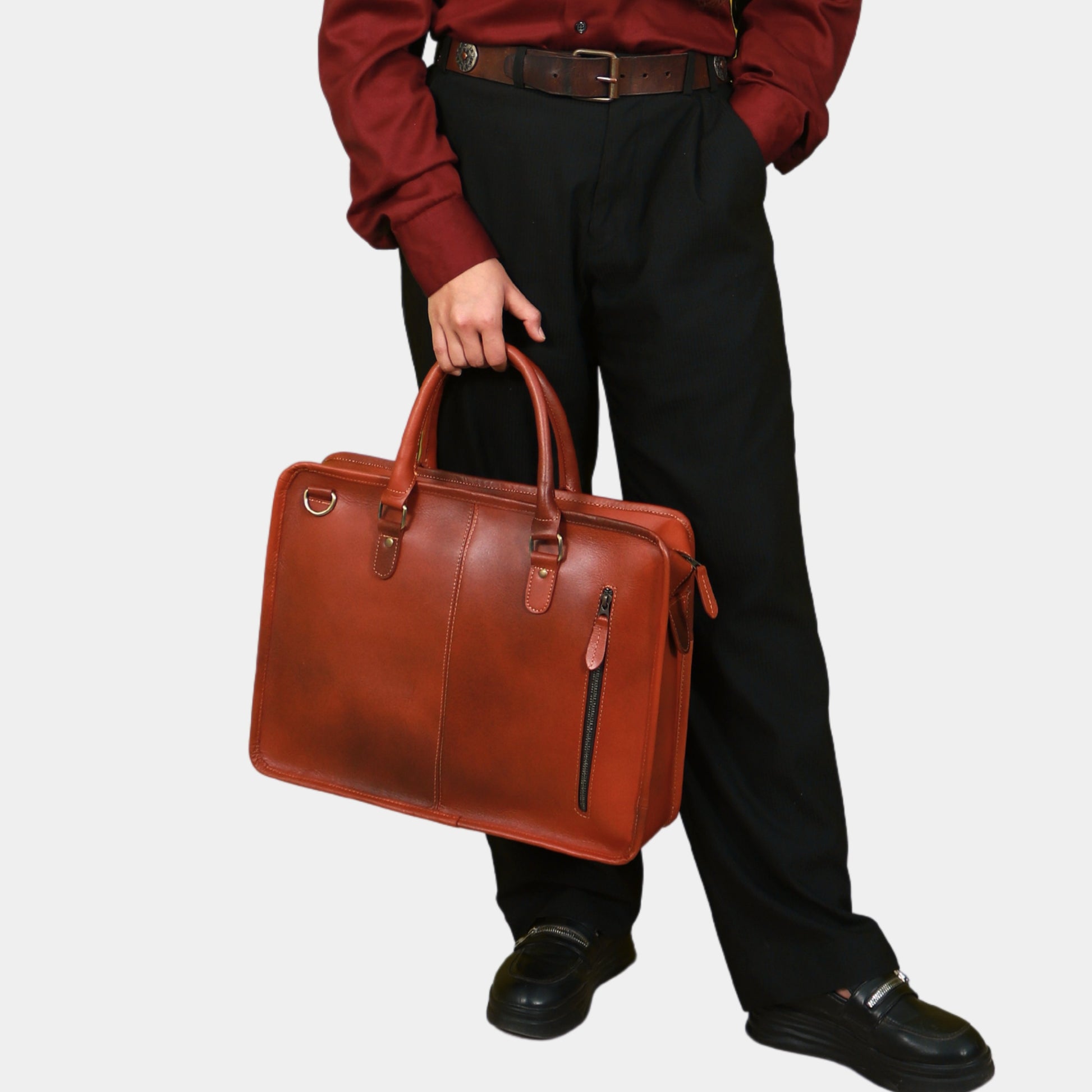 A Working Woman in formal dressing  carrying Metro Messenger Maven in her hands