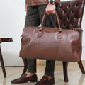 Model showcasing ease of carrying Tasman Leather Duffle Bag by TLB Australia