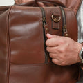 model showing Sturdy YKK zippers of 2 main compartments of Tasman Leather Travel Bag