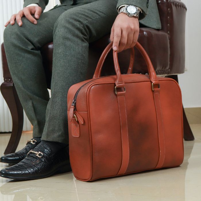 Model Posing with Commute King Messenger Australia holding soft grab handles while resting bag on floor