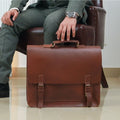 Model posing with Business Navigator Messenger By TLB Australia while sitting on sofa