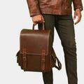 Model posing with Premium Urban Nomad leather backpack for men and women, perfect for travel in Australia