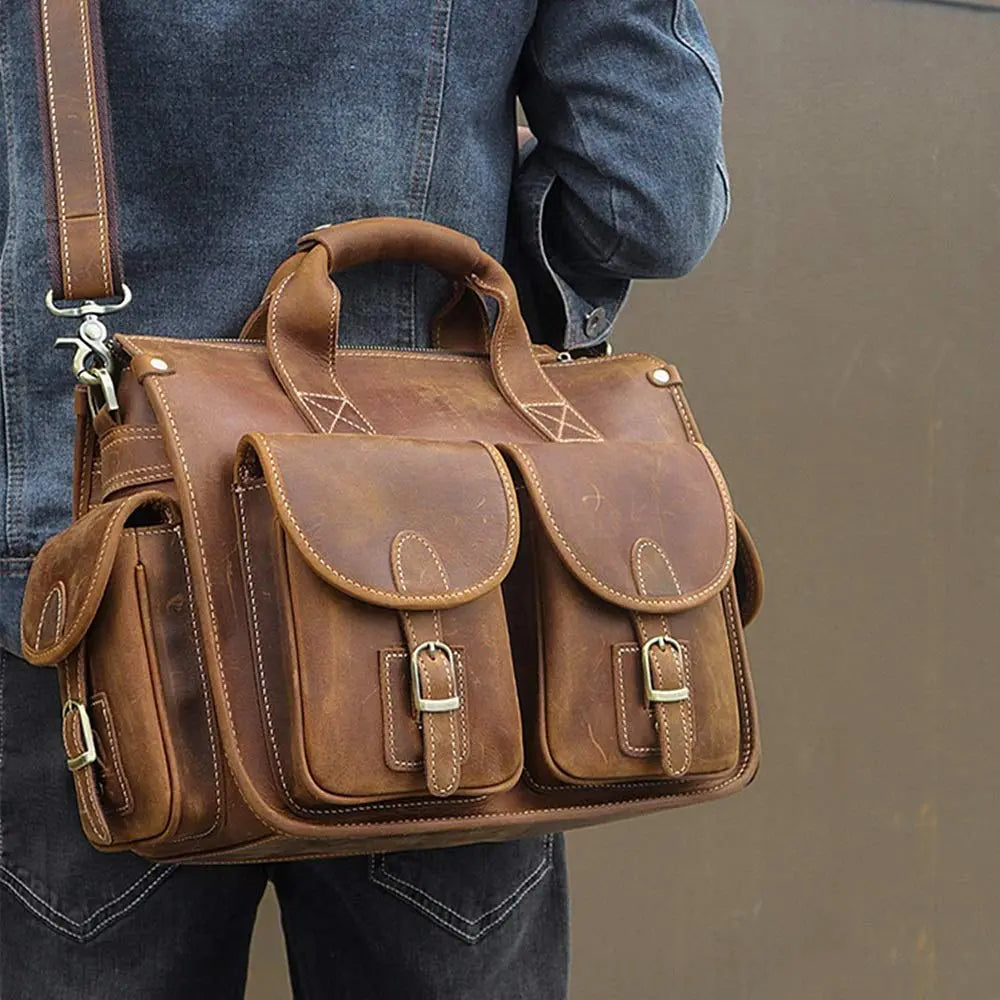 Model in blue jeans posing with The Journeyman Leather Messenger Bag