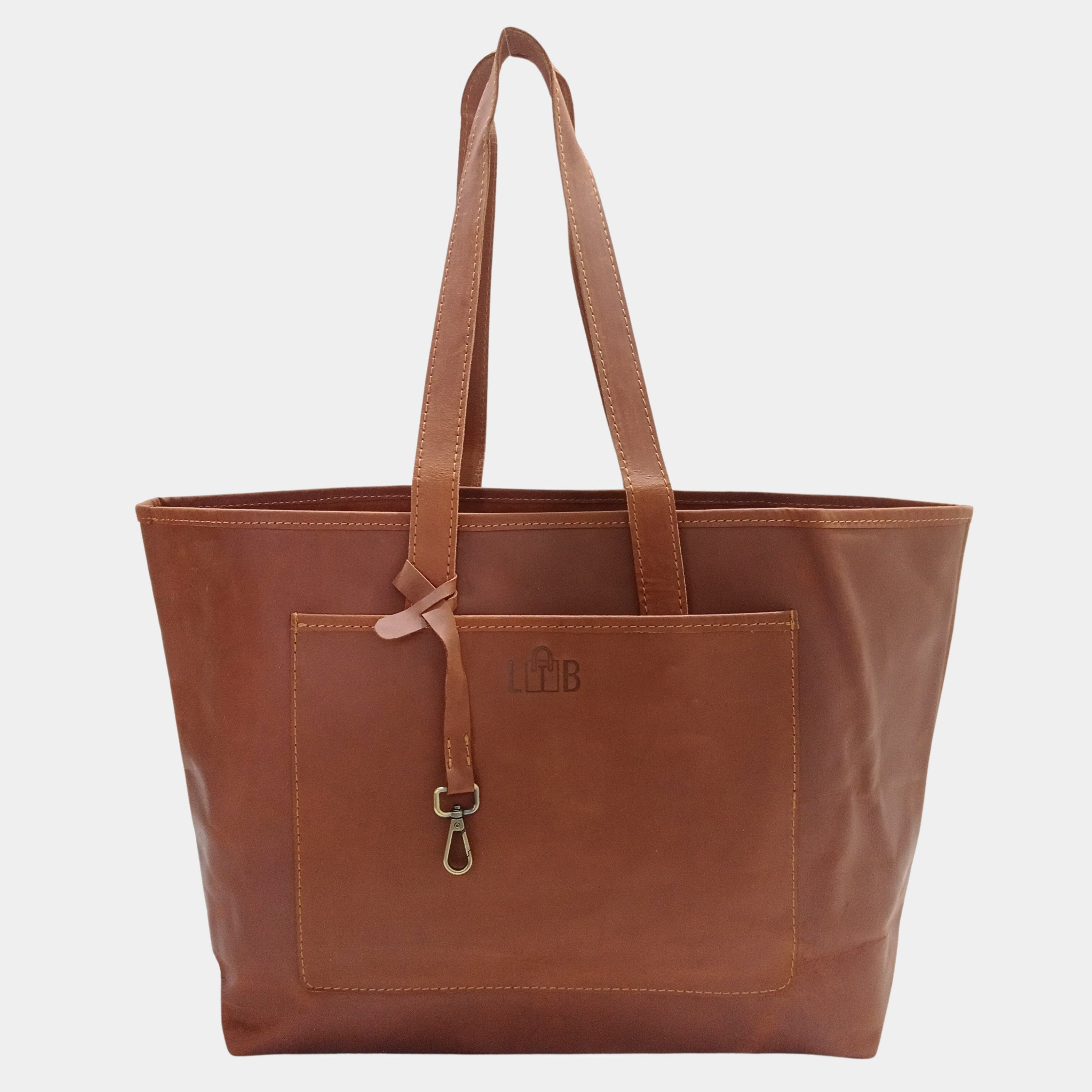 Brown leather tote bag with a visible brand logo on a light gray background
